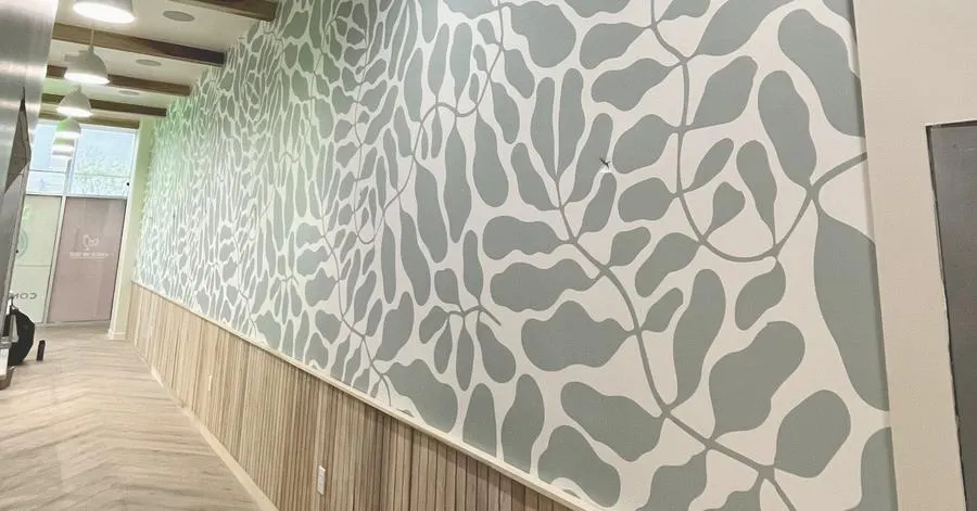 Chick Me Out interior with custom wallpaper and dimensional signage