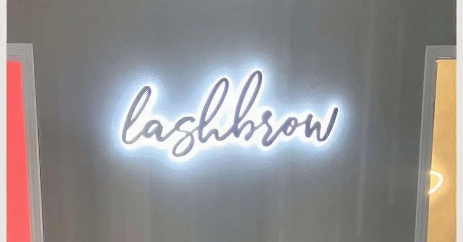 Lashbrow LED dimensional sign, illuminated letterforms on the studio wall