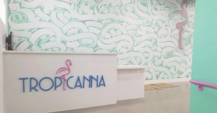 Tropicanna retail interior with custom wall wrap, dimensional signage, and branded displays